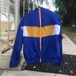 Medium zip up with hood, has rain jacket type material